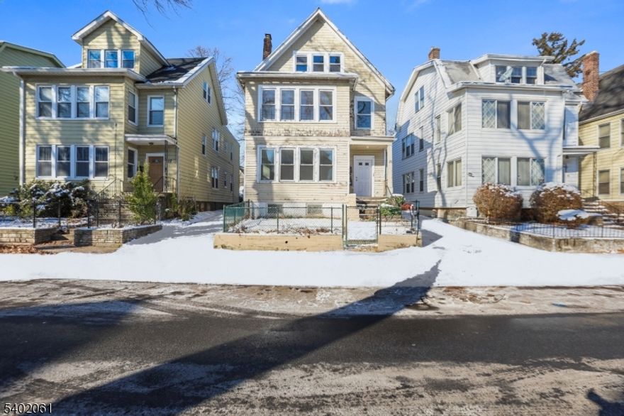 Welcome to 21 N 23rd St in East Orange, a spacious 2-family home offering strong income potential with a bonus third-level unit for added flexibility. The property features a total of eight bedrooms and three full bathrooms, with each main unit offering generous layouts that include comfortable living rooms, formal dining areas, and functional kitchens, while the additional third-level space provides valuable bonus living potential. Conveniently located near transportation, shopping, parks, and major commuter routes, this property is an ideal option for homeowners and investors seeking a versatile multi-family opportunity come get it while it's still on the market.