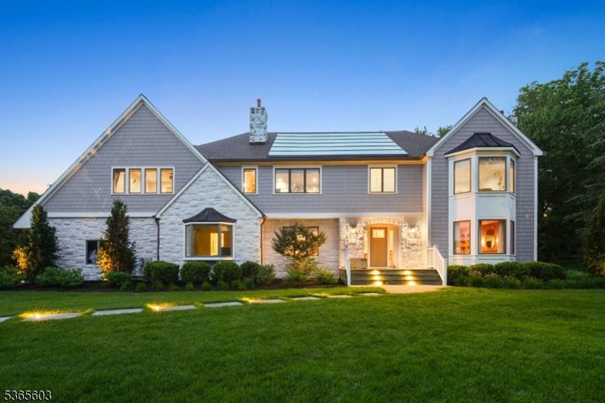 Welcome to this gorgeously renovated "Colonial Chic" estate nestled at the end of a quiet cul-de-sac in Madison's sought-after Hill section. Boasting 6 beds/5 baths & 6400 sqft of elegant living space on a private, lusciously landscaped .68-acre lot. Enter into a grand 2-story foyer w wraparound balcony & wide plank hardwood floors. The sunken formal dining & living rooms each feature wood-burning fireplaces & curated wallpaper to add sophistication to each space. A spacious family room seamlessly connects to the living room, overlooking the beautiful back yard. The heart of the home is a showstopping kitchen w oversized island, breakfast bar, dry bar & top-of-the-line Thermador range/refrigerator & Bosch dishwasher. A cozy sitting area & large eat-in make this kitchen perfect for entertaining. Upstairs, the luxury primary suite offers a private staircase, spa bath w walk-in shower & freestanding tub, WIC & expansive dressing room. 5 larger guest bedrooms including 1st floor bedroom + full bath & 2nd floor princess suite w WIC & ensuite. Finished basement with kitchenette, high-ceilings, rec room, & full bath. Add'l upgrades include owned solar panels, EV & generator hookups, surround sound & security cameras. Enjoy year round the expansive rear Trex deck w retractable awning, built-in kitchen/grill & outdoor living room w gas fireplace & heaters. Plus, features a 3-car garage. Minutes to Madison Downtown shopping/dining & NYC direct train w easy access to top-rated schools.