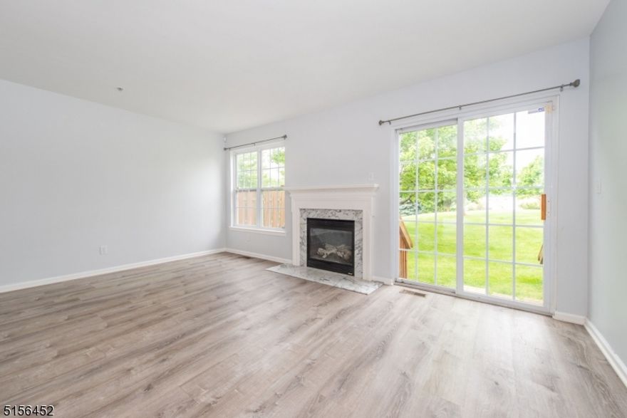 Move right into this 2 br, 2.5 bath townhome in the most desirable section of Boulder Ridge. Open Floor Plan on First Floor with Living/Dining Room combo perfect for entertaining. Enjoy the gas fireplace during the cold winter months. 2nd level offers the master ensuite with a double sink vanity, W/I closet, 2nd bedroom & 2nd full bath. Enjoy the fully finished basement with a Large Family Room, In-Unit Laundry, and huge storage room, and walk out to the Garage. High Ceilings throughout the home. Conveniently located to major highways, shops, and public transportation.