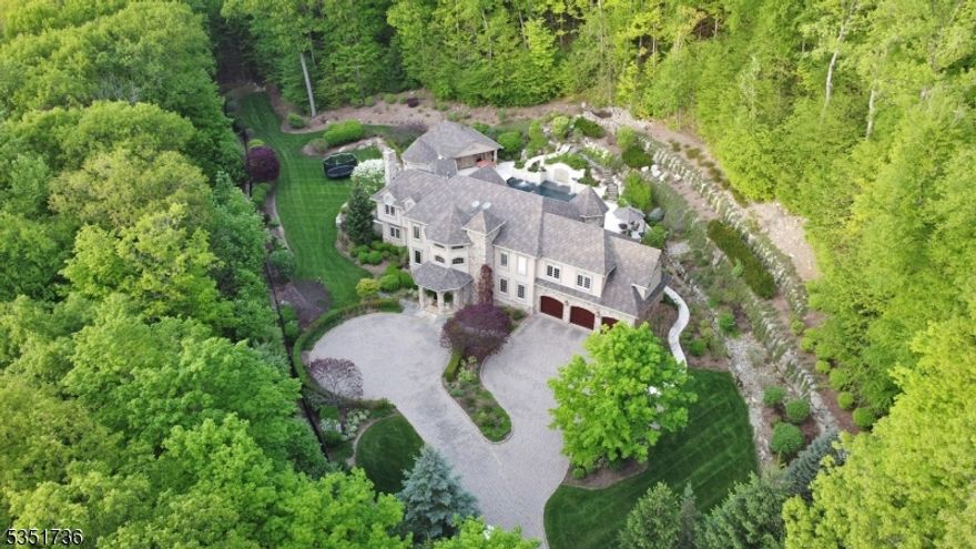 Nestled against the breathtaking backdrop of Ramapo Mountain State Forest, this exceptional 10.92-acre estate redefines luxury living. The home's resort-like backyard is an entertainer's dream featuring a stunning pool, spa, outdoor kitchen, full service cabana and lounge areas designed for memorable gatherings or serene relaxation. Custom-crafted with meticulous attention to detail, the residence seamlessly blends elegance and comfort, offering panoramic views from every window, expansive living spaces, an elevator to all levels, and top-tier finishes throughout. Whether you seek a private sanctuary or a showplace for entertaining, this one-of-a-kind home offers it all alongside direct access to miles of pristine forest trails. Surrounded by nature, yet close to shops, dining, and top-rated schools, this is the best of both worlds.