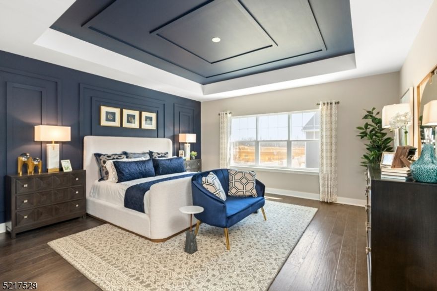 Welcome to Valley View Park in East Hanover! This stunning townhome offers the perfect blend of style, space, and location in desirable Morris County. Featuring a 2-car garage and a versatile bonus room that opens to your own private outdoor space, this home is designed for today's lifestyle. The open-concept main living level is filled with natural light and showcases 9-foot ceilings, wall-to-wall hardwood floors, and a sliding glass door leading to a private second-story deck, perfect for relaxing or entertaining. With over 2,400 square feet, this home offers 3 spacious bedrooms and 2.5 baths. The spectacular kitchen is a true highlight, complete with Silestone quartz countertops, a center island, shaker-style cabinetry, and stainless-steel appliances. The owner's suite features a generous walk-in closet and a beautifully appointed ensuite bath with a double vanity and quartz countertops. A second full bath, also with a double vanity, serves the additional bedrooms. Ideally located just minutes from shopping, dining, and everyday conveniences, with easy access to Routes 10 and 287 and close proximity to NYC transportation, this is truly a place you'll love to call home!