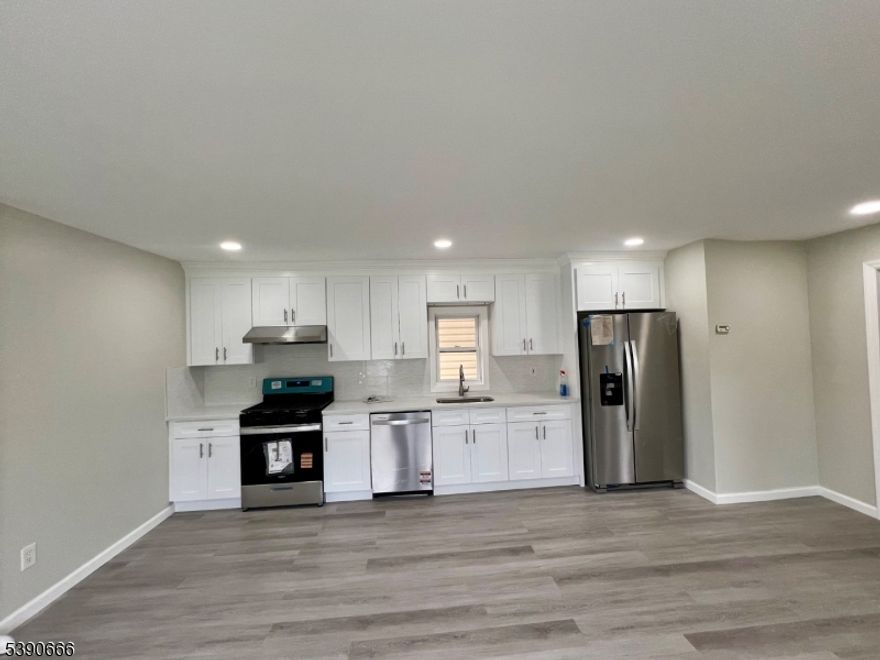 Must see! Nice 3 bed and 2 full bath house in North Plainfield between Route 22 and Route 28. Renovated Kitchen with Open Space concept of Living/Dining/Kitchen. New LVT Flooring on ground floor and second floor. Renovated 2 Full bath with standing showers. New Windows on Second Floor. Full unfinished walkout basement. Detached Garage and two car driveway with large open lot.