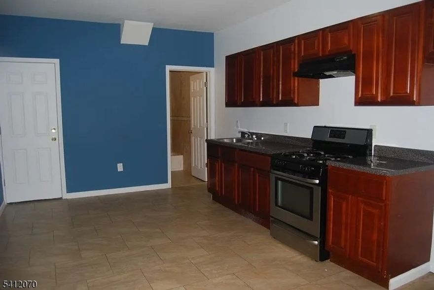 29 Alexander St, Unit 3, located in the desirable Vailsburg section of Newark, offers a well-maintained 3-bedroom, 1-bath apartment. This unit features a bright living area, a functional kitchen with ample cabinet storage, and well-sized bedrooms with natural light throughout. The bathroom includes tile finishes and standard fixtures. Conveniently situated near NJ Transit bus lines, Vailsburg Park, local schools, shopping, and major roadways, providing easy access to South Orange, Downtown Newark, and NYC commuter routes.