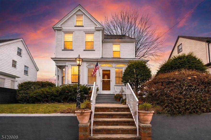 Welcome to this charming and well-maintained Victorian home located in the desirable Arlington section of Kearny, NJ. This spacious residence offers a thoughtful layout across three levels, perfect for comfortable living and entertaining. The first floor features a bright living room, formal dining room, a generous eat-in kitchen, and a convenient half bath. The second floor includes three well-sized bedrooms and a full bathroom. The third level offers a private fourth bedroom along with an additional full bath ideal for guests, a home office, or extended living space. Hardwood floors run throughout the home, adding warmth and character. Enjoy year-round comfort with central air conditioning and forced hot air heating. Step outside to a large backyard, perfect for relaxing or entertaining. The paver driveway adds great curb appeal, and the oversized garage with a loft provides endless possibilities use it as a home office, storage area, or bonus entertainment space. The garage is also equipped with electric vehicle charging connections. Leased solar panels offer added energy efficiency and potential savings. Don't miss the opportunity to own this unique and versatile home in a prime location near parks, shopping, and transportation.