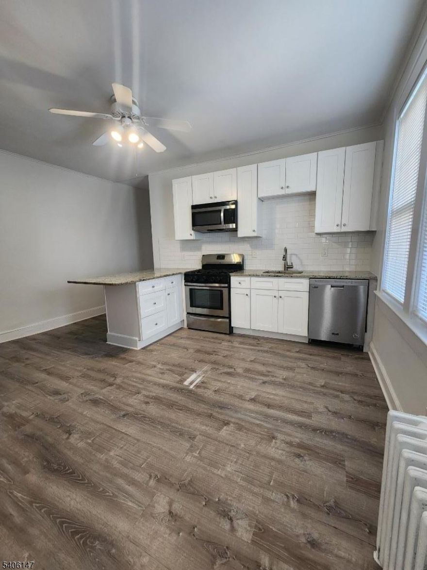 Newly renovated apartment with new stainless steel appliances and new wood floors. Fresh paint and light fixtures. No need to share laundry, washer/dryer in unit. Tons of natural sunlight and spacious rooms. One off street parking spot is included, additional off street spot available for a $100/monthly fee. Shared backyard. Convenient location close to all shops, restaurants and transportation. Owner pays for water. Renters responsible for gas and electric. No smoking allowed. Small pets (up to 20 pounds) permitted. Storage in basement for an additional monthly fee.