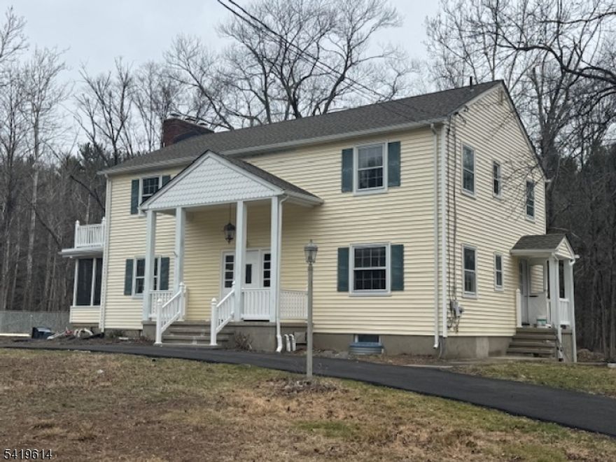 Spacious 5-bedroom home set on a full acre in Ringwood, offering a flexible layout and great potential for customization. The property features a brook at the rear, adding a natural backdrop, and is not located in a flood zone. This home is in need of TLC and is ideal for buyers looking to renovate and make it their own or investors seeking their next project.A standout feature is the fully finished walk-out lower level, which can function as a true in-law suite with its own private entrance, kitchen, living room with fireplace, bedroom, full bath, laundry, and sliders to the backyard. The main level includes a living room with wood-burning fireplace, an enclosed porch, updated kitchen, dining room, half bath, and an additional bedroom. Upstairs offers a large primary bedroom with walk-in closet, two additional bedrooms, office, a full bath, and second-floor laundry. A recently paved circular driveway adds both convenience and curb appeal, providing ample parking and easy access. Conveniently located near the Highlands Natural Pool, where you can enjoy swimming, picnicking, and the outdoors. A solid opportunity for those with vision to bring this home to its full potential. Home being sold AS IS. Cash buyer preferred.