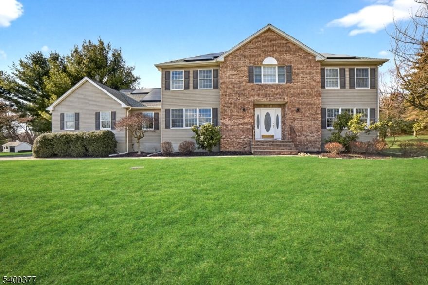 Welcome to this spacious and well-maintained 4 bedroom, 2.5 bath single-family home offering over 3,000 sqft of comfortable living space in one of Long Valley's most desirable neighborhoods. Situated on a generous lot, this home blends modern efficiency with everyday convenience.The first floor features a bright and functional layout, including a welcoming living room, a cozy family room, a formal dining room, and a dedicated office just off the living room perfect for remote work or quiet study. The large kitchen offers ample cabinetry and sliders leading directly to the backyard, making indoor-outdoor entertaining a breeze. A main-floor laundry room and convenient half bath complete this level.Upstairs, the second floor includes a spacious primary bedroom with its own sitting room and private bath, along with three additional bedrooms and a full hall bathroom.A full, unfinished basement provides excellent storage or future potential. Sustainable living comes easy with Tesla solar panels which covers electricity usage up to 15,000 kWh per year, and a Tesla Powerwall that acts as a backup generator during outages. The property includes a 2-car garage and an extra-long driveway that fits 10+ vehicles ideal for guests, hobbies, or multiple drivers.Nestled in a quiet, friendly community close to parks, schools, and local amenities, this home offers comfort, space, and modern upgrades in an excellent location.Fireplace is for aesthetic purposes only.Pool not included in rental.