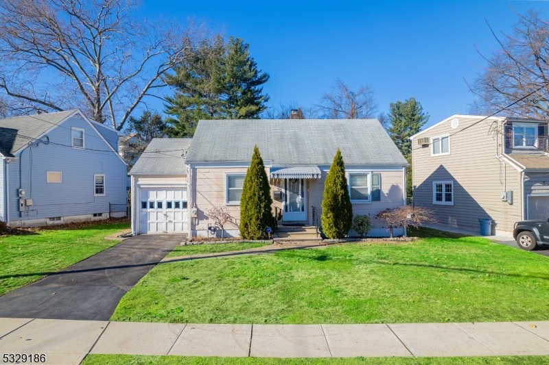 Welcome home to the cozy charm that is 40 Surrey! Nestled in the heart of desirable Clifton, NJ this ranch home featuring 2 bedrooms, 1 bath & a 1 car garage is the perfect place to call home. Solid, hardwood floors throughout the property with an updated kitchen featuring SS appliances & generously sized bedrooms and is flooded with natural light. Added bonus of sun room off of kitchen leads straight out to a spacious yard with BBQ patio perfect for entertaining guests. Forced hot air/central air and full, dry basement with high ceilings perfect for extra storage. Complete with the golden trifecta of public sewer, public water & natural gas. Conveniently located to multiple forms of access to NYC, major highways, transportation, shopping, restaurants, etc.