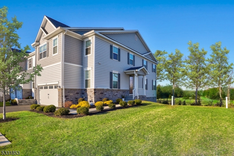 STUNNING, SUNDRENCHED, TOWNHOME at Glen Oaks. A rare opportunity to own a Fordham End-Unit, the builder's featured floor plan. This extraordinary home features upgrades beyond the builder's offerings and rivals the model home. The chef-inspired kitchen is sure to impress with shaker cabinets, quartz counters, SS high-end appliances, large center island, and pantry. The open-concept living/dining room seamlessly transitions to the kitchen, cafe, and deck where you can enjoy your morning coffee or dine al fresco. The upper level features the primary bedroom with tray ceiling, large W/I closet, and luxury ensuite with over-sized shower and free-standing soaking tub. The expansive loft offers additional space for multiple uses, a conveniently located large laundry room, two additional bedrooms with W/I closets, and another full bathroom. Looking for more living space? The finished lower level with direct access to the yard is a party central zone, media room, home office, gym, and the additional storage areas seem endless. Beyond the home itself, the view of the open green space offers privacy and tranquility rarely found in townhome living. Minutes to the best beaches in Monmouth County, direct access to the Garden State Parkway, close to Wall Township's Highly rated schools, and close proximity to shopping and dining.  What is not to love?!!