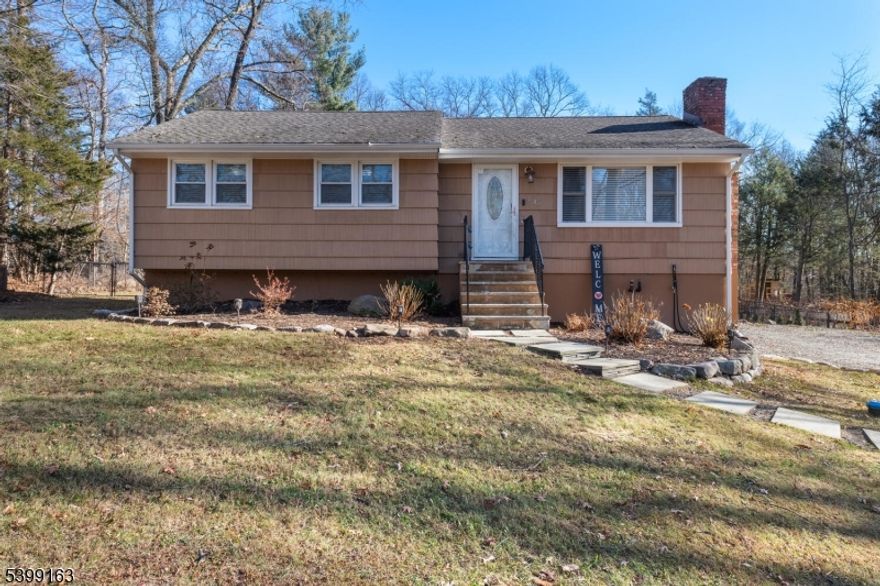 Move in ready. A surprising variety of living spaces from top to bottom. The bright and airy skylit kitchen with granite counters and stainless appliances looks out past the sliding doors to the oversized deck and back yard, over 300 feet deep, fenced and more private than one would expect being on a primary road. The living room has a wood burning fireplace and plenty of firewood in the way back of the yard. Two full bathrooms, one up and one down, along with a laundry room, utility room, lots of closets, even a pull down attic ladder provide tons of storage space. The walk out basement to the oversized driveway is from an extra room downstairs that is easy to bring back to the build-in garage the home started with. See the home and septic inspection reports, permit history along with title and the tax record card in the listing media.