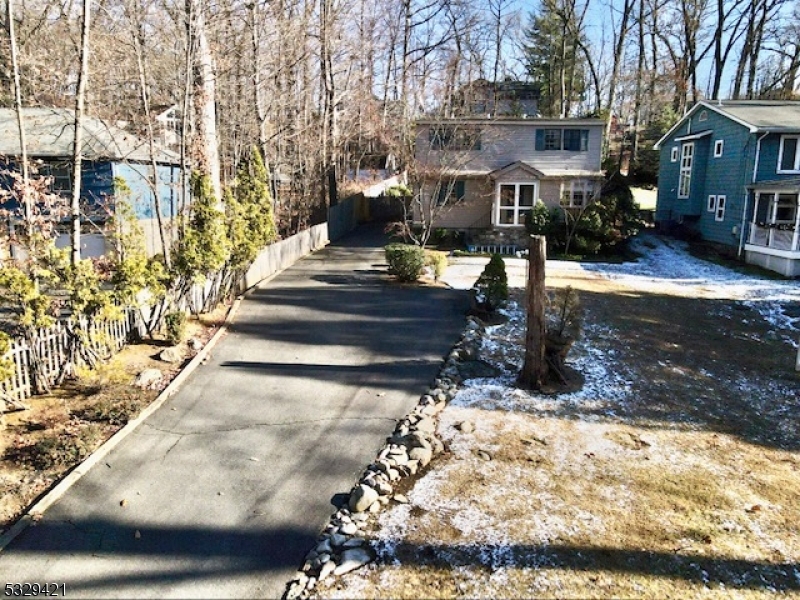 Charming Cape Cod style home in Rock Ridge section of Denville.  This home features living room with gas fireplace  & coffered ceilings. skylights in kitchen, atrium room / sunroom.  Bring your imagination, paint, add some extra light, and update this home to tap into it's real potential!  Nice sized lot, gently sloping backyard, plenty of parking in driveway can accommodate multiple vehicles.  Great location in a quiet, low traffic neighborhood that is near Rock Ridge, Cook's Pond & downtown Denville.