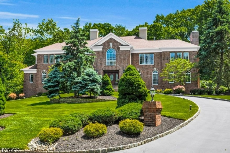 Prepare to be captivated by this Stately Colonial Home nestled in a cul de sac neighborhood. The home features 5 beds/6.1 baths, 3 fireplaces, oak hardwood flooring, 6100+ sq ft of living space all set on a 2-acre lot. The manicured landscape and circular drive lead to a bluestone front porch and custom wood entry door. Enter the grand two-story foyer w/granite floors, sweeping staircase and crystal chandelier. The architectural beauty continues with an arched entryway leading to a gourmet kitchen. This chef's paradise is filled with natural light and features customer cabinets, stainless appliances, granite countertops, walk-in pantries and large dining area. Entertain effortlessly in the formal dining room adorned with crystal chandelier or gather in the great room with gas fireplace. Relax in the spacious living room with custom inlaid wood flooring or retreat to the library with built in bookcases and wood burning fireplace. Enjoy the beautiful private yard from the maintenance-free wraparound deck. Retreat to the second-floor primary suite sanctuary, complete with a hand painted mural, ensuite bath, dressing area, and multiple walk-in closets. Enjoy four additional bedrooms, including one on the first floor all with their own ensuite baths, ensuring privacy and comfort for all. The lower level offers nearly 2000 sq ft and features an exercise room, dance/media room, bar/game room, craft/photography room and a marble bath with radiant heated flooring. Top rated schools !!