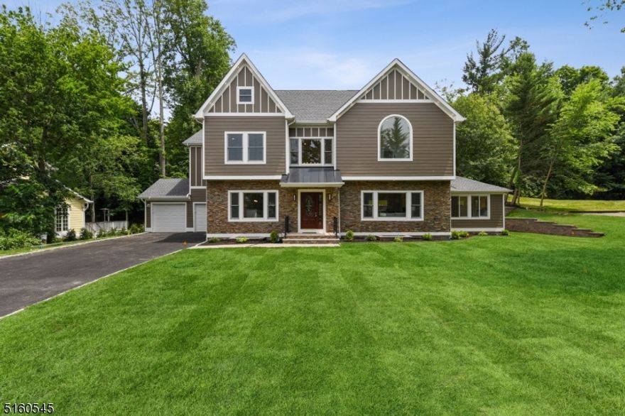 Look for a new construction in Short Hills? Your dream just comes true! Designed by a famed local architect and located in highly desirable Deerfield section, this spectacular colonial combines open concept, modern, convenience and luxury into a dream home. More than 6120 SQFT living space consists of 4 finished levels with high ceilings, 5 suites, offices & bonus rooms. Oversized windows throughout the house bring abundant natural light for every room. The Inviting two-story foyer opens to dining room, living room, & kitchen. The spacious dining room leads to the butler's pantry w/beverage fridge. The gourmet kitchen boasts a 10'x5' giant waterfall island, custom wood cabinets, top end appliances, dual sinks, large brkfast room. The living/family room features an elegant fireplace and open to patio and backyard. The swirling staircases with 3-story stairwell is a big wow. The spacious in-law suite with separate entrance completes the 1st floor. Second floor boasts a large master suite w/two WICs, spa-like bath w/jetted tub/stall shower, and a large private balcony. Three other suites and spacious laundry room complete the 2nd floor. The finished 3rd floor is a giant playroom/office w/potential for another suite. The 9' ceiling basement is great for entertainment, exercise and social, with a full bath & an office/maid quarter. The wet bar connection is ready. 4-zone HVAC. Conveniently located with walk to schools, mins to downtown, Short Hills Mall, NYC direct train &parks.