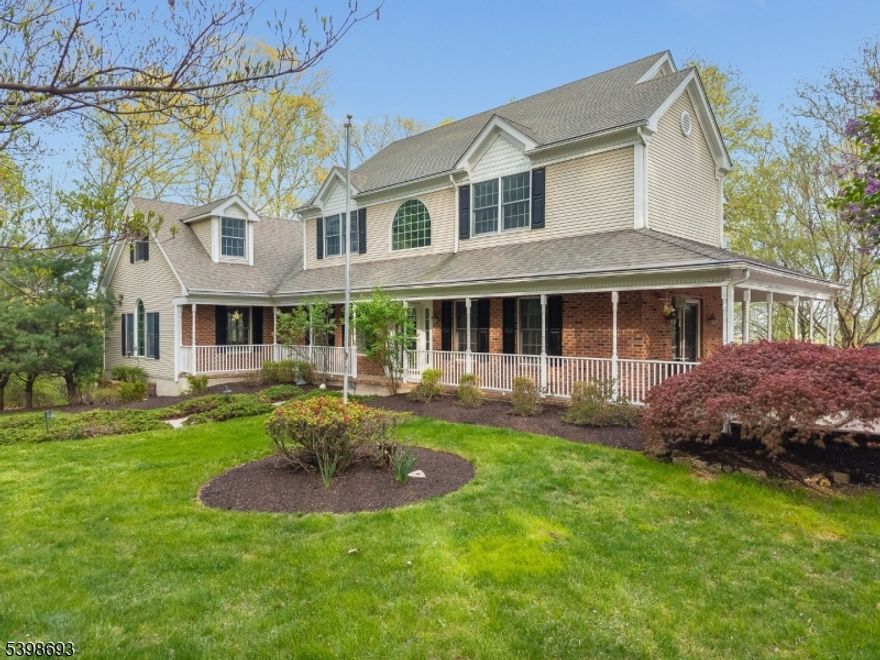 Set on a quiet cul-de-sac with scenic mountain views, this beautifully maintained Colonial sits on over 3 acres of freshly landscaped grounds in the highly regarded Union Township Schools and North Hunterdon High School District. The first floor offers a spacious eat-in kitchen with SS appliances, Viking range, Bosch dishwasher, center island, walk-in pantry, and access to a composite deck for easy indoor-outdoor living. Formal living and dining rooms provide timeless appeal, with French doors from the living room opening to the wrap-around porch. An oversized first-floor laundry room w/sink and basement access adds convenience, while the expansive family room features vaulted ceilings and a wood-burning fireplace. A versatile main-level bonus room with French doors is ideal for a home office or flex space. Upstairs are four bedrooms, including a primary suite with en suite bath, double sinks, soaking tub, stall shower, and large walk-in closet, plus a second full bath with double sinks. The fully finished walk-out basement includes a full bath & steam shower, wine room, multiple finished areas, garage access, and patio access. The outdoor living space is a true highlight, featuring an in-ground gunite pool, hot tub, expansive patios, and a fully equipped pool house with kitchen and full bath perfect for relaxing all season long. Additional features include serene wooded privacy, three-car garage, shed, whole-house generator, numerous upgrades, and easy access to Route 78.