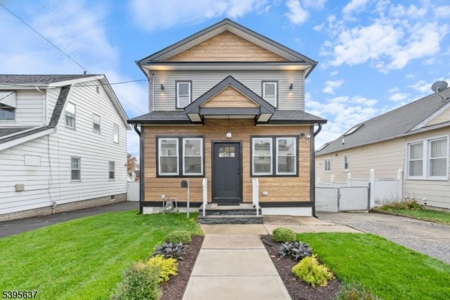 Welcome to this beautifully expanded single-family Colonial offering 4 spacious bedrooms and 3.5 baths. Designed for modern living. The main level features a versatile bedroom; perfect for guests or a home office. Along with a bright open-concept living and dining area. The brand-new kitchen showcases custom cabinetry, stainless steel appliances, and elegant finishes, making it the heart of the home. A convenient powder room completes the first level.Upstairs, you'll find additional bedrooms, including the primary suite with a custom walk-in closet, and a stand-alone shower. The fully finished basement offers a large family room, additional room ideal for entertainment or relaxation, plus a full bath for added convenience. Enjoy new flooring throughout, updated systems, and quality finishes in every detail. Conveniently located near shopping, and major transportation for an easy commute. This move-in-ready Colonial combines comfort, space, and modern style.