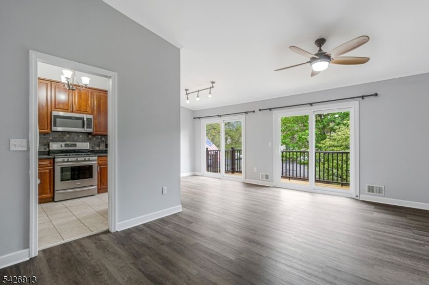 This beautifully updated one-bedroom condo offers a bright, open floor plan designed for both comfort and style. The spacious living and dining areas are filled with natural light, thanks to two sets of sliding glass doors that open onto a large deck perfect for relaxing or entertaining. additionally,  you'll find all-newer luxury vinyl plank flooring throughout, adding a modern and cohesive feel. The updated kitchen features sleek stainless steel appliances, while the renovated bathroom offers contemporary finishes.  A versatile loft space provides the perfect area for a home office, guest space, or cozy retreat. The generously sized bedroom includes its own sliding glass doors leading to a private balcony, along with a large closet for ample storage. Additional highlights include a convenient in-unit laundry room and thoughtfully designed living spaces that blend functionality with modern upgrades. One car garage with opener  offers you designated parking  in the garage or a spot in front.  All 3 sets of sliding doors are brand new, as well as both decks and railings.  $195 special assessment through July 2030 all the decks/siding/and sliding doors being replaced. The complex has many amenities - 20% down needed until all buildings are completed.