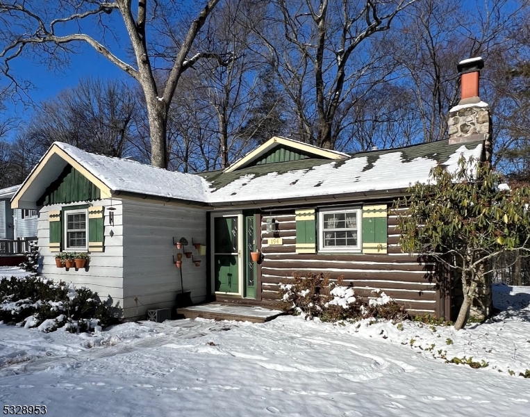 Beautiful Lake Mohawk Crane Home/Log cabin style home dating back to 1927 with historic background and Updated with expanded living areas! Beautiful living room with original Crane/stone fireplace. Large eat in kitchen and 3 large bedrooms, 2 full baths make this a home you can definitely spread out in! Back deck with partial winter views of Lake Mohawk. Finished large basement with wood burning stove make this home complete! Natural gas heat and electric heat as a backup. You won't want to miss this gem with private backyard and all the lake amenities. Not a drive by... house is much larger than what is seen from the street!