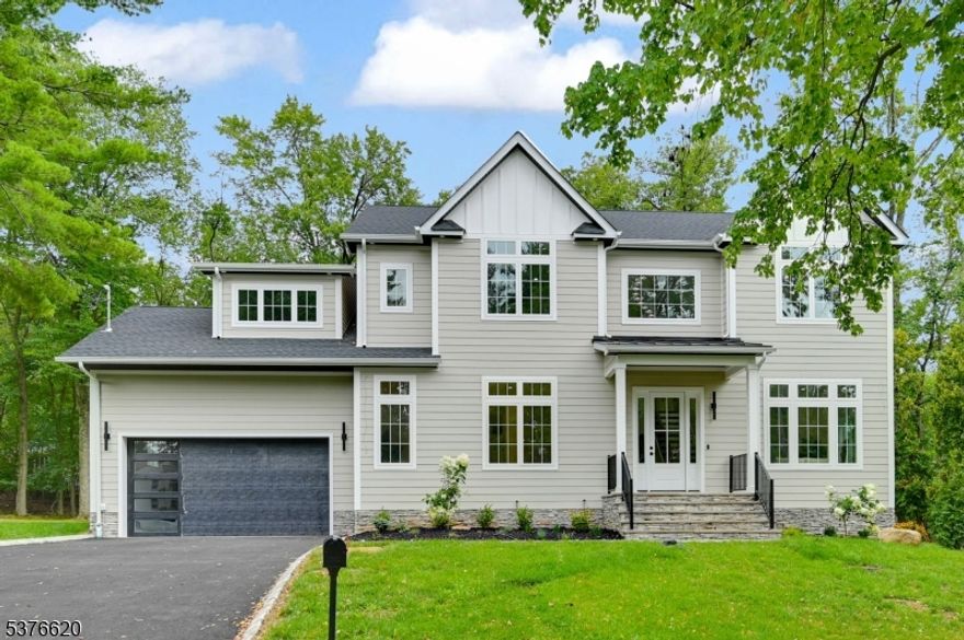 Welcome to this stunning NEW CONSTRUCTION colonial home, located in the desirable neighborhood on a quiet street. Set on approx Half Acres, this impressive 6-bedroom, 5.5-bathroom home offers 5,200 sf of luxury across three levels. The grand Double-Height foyer introduces the main level. Inside, the gourmet eat-in kitchen is a chef's dream, featuring custom cabinetry, a spacious center island, high-end appliances, quartz countertops, and a walk-in pantry. The family room flows seamlessly from the kitchen & includes an elegant electric fireplace and sliding doors leading to a large paver patio and expansive flat backyard ideal for entertaining. The first floor boasts 10ft High Ceilings, which also includes a formal living room, sophisticated dining room, guest ensuite, stylish powder room, and functional mudroom. Upstairs with 9' ceiling height has four generously sized bedrooms, including a luxurious primary suite with private balcony, spa-inspired bathroom featuring a soaking tub, stall shower, and dual sinks. One additional bedroom is en-suite while the other two share a full bathroom. A convenient laundry room completes this floor. The finished basement boasts impressive 9-foot ceilings and provides additional living space with a bedroom, private office or playroom, large recreation room, full bathroom with additional storage rooms. Modern smart home features and a 10yr reputable builder's warranty ensure peace of mind. Close to schools, major highways, parks and more.