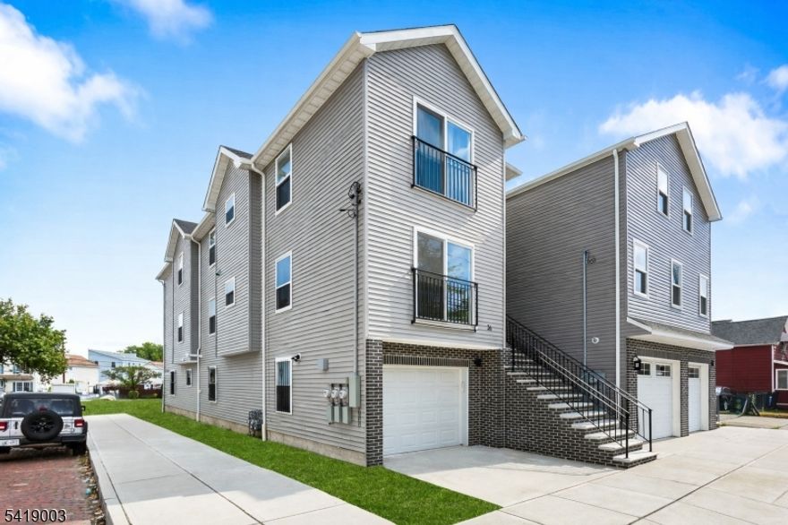 Beautiful newly built two-family home offering modern design and comfortable living. This bright and spacious property features a sleek exterior with attractive siding, large windows that bring in plenty of natural light, and a charming private balcony. The home includes a built-in garage, private driveway, and a welcoming staircase leading to the main entrance. Inside, enjoy contemporary finishes, an open and airy layout, and thoughtfully designed living spaces perfect for everyday living and entertaining. This house offers wonderful living spaces that combines functionality with a cozy ambiance. The bedrooms are generously sized bedrooms. The bathroom is tastefully designed with modern fixtures for your daily routines. Conveniently located near shopping, dining, transportation, and major highways, this home combines style, comfort, and accessibility. A fantastic opportunity to own a move-in-ready new construction!