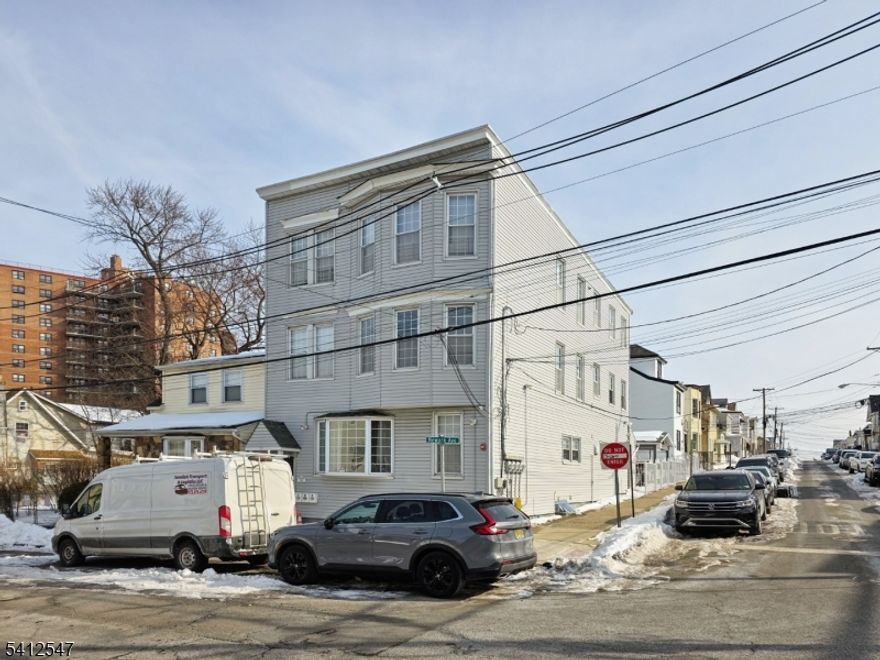 Don't miss the opportunity to own this well-maintained, income-producing multi-unit property located at 80 Newark Ave, Paterson, NJ 07513. Ideally situated near major highways, public transportation, shopping centers, restaurants, and local amenities, this property offers outstanding convenience.Renovated approximately 15 years ago, the property has been consistently cared for and offers spacious layouts in each unit featuring hardwood floors, granite countertops, wood cabinetry, and central air conditioning features that help attract and retain long-term occupants. The thoughtfully designed floor plans provide comfortable and functional living spaces, making this an excellent option for rental income or owner occupancy.The finished basement significantly enhances the usable square footage and includes a sitting/recreation room, full bathroom, and laundry area, offering flexible use such as recreation space, home office, or additional storage.Outdoor living truly sets this property apart. The fully fenced yard with a durable metal fence, mature landscaping, and vibrant flowers creates a private retreat ideal for entertaining or quiet relaxation.This property presents a strong investment opportunity with low maintenance, modern systems, and desirable amenities. A rare chance to own a move-in ready multi-family property in a convenient Paterson location.