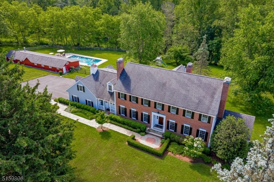 Exceptional custom home situated on over 5 acres. Gourmet kitchen w/Carerra marble and granite counters. Persian marble mosaic tile accent backsplash. Dacor 6 burner stovetop, warming drawer. Electrolux double wall oven. 2 dishwashers, separate breakfast area w/access to Tennessee bluestone patio. Open family room with gas fireplace. Custom moldings and solid oak floors throughout. Large foyer w/ Mahogany front door, first floor office w/ full bath, large LR and DR w/ Fireplaces. Mudroom w/ Subzero refrigerator/freezer, half bath and full laundry room. Second level includes Master bed w/walk in closet, custom cabinetry, full bath w/jetted tub, stall steam shower, custom cabinets & travertine counter. 4 add'l bedrooms, 2 bedrooms en-suite with custom baths and walk in closets,  2 bedrooms with walk in closets.  Second level sitting area w/access to upper deck, additional 2nd level laundry room. Finished w/o lower level inc. large rec room, play room & exercise room, workshop, and storage. Pella UV resistant windows. Barn w/radiant heated floor & sliding doors opening to pool. This large barn has the potential to be an exceptional outdoor kitchen/game room. The gunite pool is heated & has Tennessee bluestone decking. Brick & bluestone walkways, newly realigned and paved driveway, deer fenced property, brick and limestone columns w/cast iron lanterns and custom gates. Doorbird video and audio alert system, full house generator. 6721sf per floor plans. 6 bdrm town verified septic