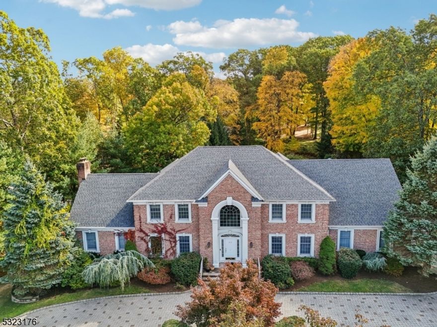 Move-In Ready! Nine foot Ceilings on the first floor, Hardwood Floors, Great Moldings and Trim throughout, Newer Roof and A/C Compressors, Circular Drive...Large Eat-in Kitchen with access to Covered Deck and backyard with patio...Walk-Out lower level...Built in 1999, on an almost level .973 of an Acre