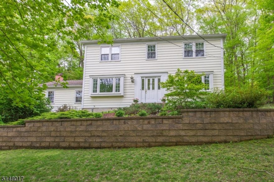 Spacious Shongum Lake colonial offers a terrific floorplan with huge kitchen, dramatic family room with fireplace, vaulted & beamed ceiling, formal living and dining rooms.  Spacious bedrooms plus "flex room" on second floor, perfect for home office. Hardwood flooring throughout, partially finished basement, low maintenance natural and private landscape with mature trees and deck.  Shongum deeded lake rights include swimming, beach, clubhouse, boating, playground, community events year round for an annual fee.  Public utilities, Randolph Twp. schools, great commuter location on east side of Randolph, 10 minutes to Morris Plains Midtown Direct NJ Transit Train Station.