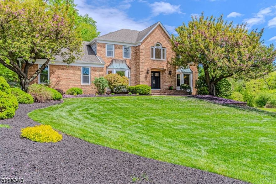 Nestled in one of Denville's most desirable neighborhoods, this stately colonial offers an upscale lifestyle on a quiet cul de sac amid an enclave of luxury homes. A striking 2-story foyer announces the home's modern elegance. The entry is flanked by a spacious, formal dining & living room. The hub of the home is either the family room w/a floor to ceiling brick faced, WB fireplace or the showstopper, renovated kitchen w/quartz counters, oversized center island, high end SS appliances which include a 6 burner gas oven & hood, fridge, d/w, a bev center & microwave drawer. The office showcases french doors. Laundry/mudroom w/easy access off the garage. Great space & floorplan for entertaining. Upstairs you'll find an indulgent primary suite & 3 addtl bdrms. Primary en-suite features a double vanity, jacuzzi & stall shower. Beautiful travertine tile. Guest bath is updated w/a touchless faucet. Full, finished bsmt-Media room w/surround sound, wet bar, full bath, exercise room & game/play room. PLENTY of storage in the bsmt, attic or 2 Car Garage. Skylights & new windows w/custom blinds, provide tons of natural light. The deck eases the transition from living indoors & out. Lovely & leveled grassy areas plus patio space! Completely fenced in. Professionally landscaped oasis offers a ton of privacy amidst mature trees & perennial gardens. Great location, just mins from Union Hill Shopping Center, Denville's bustling DWTN, Morristown Green, NYC-Direct transport & major hwys.