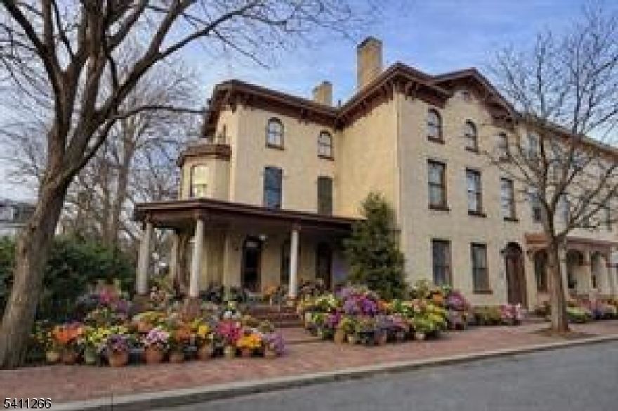 Positioned in one of Lambertville's most desirable residential corridors, the John Coryell House presents a rare opportunity to acquire a fully leased, five-unit asset in a high-demand river town market. This historically significant property combines enduring architectural appeal with consistent rental performance, making it an exceptional addition to an income-focused portfolio. Set on a landscaped parcel with award-recognized gardens, the building offers five spacious residences designed to attract long-term tenants seeking character, light, and walkable convenience. High ceilings, arched openings, original wood floors, and preserved decorative detailing provide a level of authenticity rarely found in multi-family offerings. Covered porches and shared outdoor spaces enhance tenant experience, while a mix of traditional and private-entry units supports flexible leasing strategies. The former single-family estate has been carefully adapted to modern apartment living, preserving its historic identity while supporting efficient operation. Located moments from downtown Lambertville and neighboring New Hope, this property benefits from strong rental demand, limited comparable inventory, and long-term appreciation potential. Zoned residential and currently operating as a stabilized five-unit building, it represents a compelling blend of architectural distinction and reliable income. Interior photos coming soon.