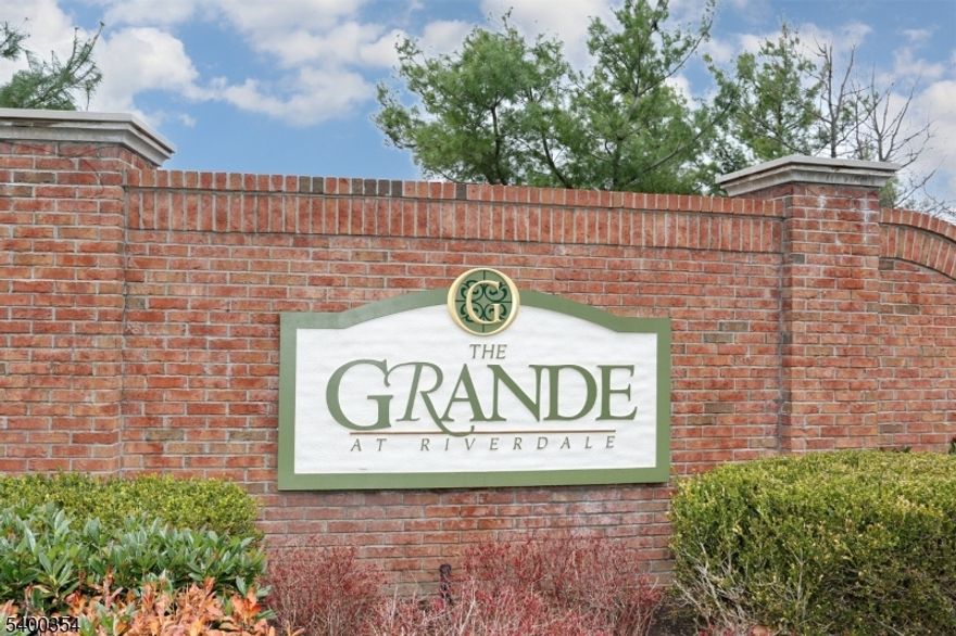 This pet-friendly condo offers a quiet, private one-bedroom layout with an additional den?perfect for a home office, guest space, or daybed. Located on the upper floor of an elevator building, it features serene treetop and mountain views, a covered balcony, and an open living/dining area. The updated kitchen includes a breakfast bar, granite counter-tops, back-splash, stainless steel appliances, pendant lighting, and an in-unit washer/dryer. This is the larger one-bedroom layout, offering generous space and a well-designed floor plan. The unit includes one assigned garage parking space, ample guest parking, and is part of a smoke-free building. Residents enjoy outstanding community amenities: two clubhouses, two pools, tennis courts, fitness centers, billiards rooms, conference and party rooms, and more. Close to major highways, shopping, restaurants, and everyday conveniences. Available January 1st?Live the Grande Life!