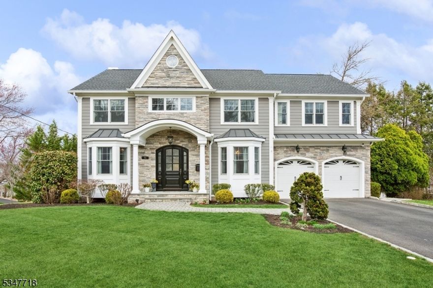 Chic design choices and moody accents add sophistication and style to this elegant Colonial in the highly sought-after Westfield neighborhood of Wychwood. With striking curb appeal, custom landscaping and modern amenities, this 6 bedroom, 6.5 bath home is perfect for comfortable living and easy entertaining alike.The first floor unfolds into a spacious open-concept living space with gourmet kitchen, complemented by a butler's pantry that seamlessly flows to the formal dining room. A cozy library provides a quiet retreat, while the mudroom entry off the garage adds practical convenience. The main level also includes a generously-sized ensuite bedroom, ideal for guests or private office space. On the second level, you'll find four bedrooms including a guest room with its own ensuite, plus two bedrooms sharing a jack-and-jill bath. The primary suite with double-door entry includes a large ensuite bath, walk-in closet, and cozy gas fireplace. The sixth bedroom can be found on the third level, along with a full bath perfect for a guest suite or additional living space. The expansive lower-level is designed for ultimate entertainment, featuring a dry bar, the 6th full bath, and a walk-out area leading to a custom stone patio. This outdoor space is beautifully set against a backdrop of a lush, tree-lined backyard.This property a truly exceptional find in one of Westfield's most desirable neighborhoods. You'll fall in love with this one, come see for yourself.