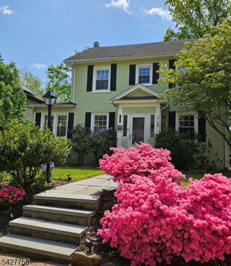 More pix coming of this Beautifully situated Colonial in the highly sought-after North Plainfield neighborhood. This charming home features gorgeous wood floors throughout. A welcoming entrance vestibule leads into a spacious living room complete with a wood-burning fireplace and custom built-in wall unit. Just off the living room, enjoy a sun-drenched sunroom or home office with elegant French doors. The main level also offers a large formal dining room and an eat-in kitchen conveniently located down the hall. Upstairs, the second level boasts three generously sized bedrooms and a full bath. The attic, accessible via pull-down stairs, provides an abundance of additional storage space. The full basement includes the added convenience of a toilet and offers great potential. Outside, you'll find a fenced-in yard and a large two-car garage, perfect for parking and storage. Enjoy a prime location close to shopping, major highways, and easy access to New York City transportation. Sold as - is Buyer responsible for town Certifications and Fire Inspections.