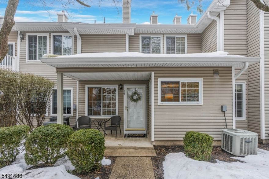 Step into light, space, and effortless living in one of Signal Point's most desirable models. A front patio welcomes you to this beautifully maintained townhouse, the second largest model in Signal Point. Move-in condition and thoughtfully designed with an open floor plan, this home features a dramatic two-story living room filled with natural light. The kitchen offers stainless steel appliances, granite countertops, a double sink, new garbage disposal, and a large accent window. The kitchen flows seamlessly into a separate dining area. Convenience abounds with direct access to the garage on the main level, a mudroom, powder room with pebbled marble countertop, and a laundry closet with built-in shelving.The second level boasts two spacious, privately separated bedrooms and two full baths. The primary suite features a large walk-in closet and an en-suite bath complete with a generous shower, glass doors, and tile flooring. Wood composite flooring enhances the first level, while wall-to-wall carpeting adds comfort upstairs. Fireplace is decorative only. Original windows have been replaced which adds additional energy efficiency. Enjoy resort-style living with access to the community's Olympic-size pool, year-round clubhouse, and fitness center located one street away. Ideally located near restaurants, shopping, and major roadways plus the convenience of the community Village Center just moments away.