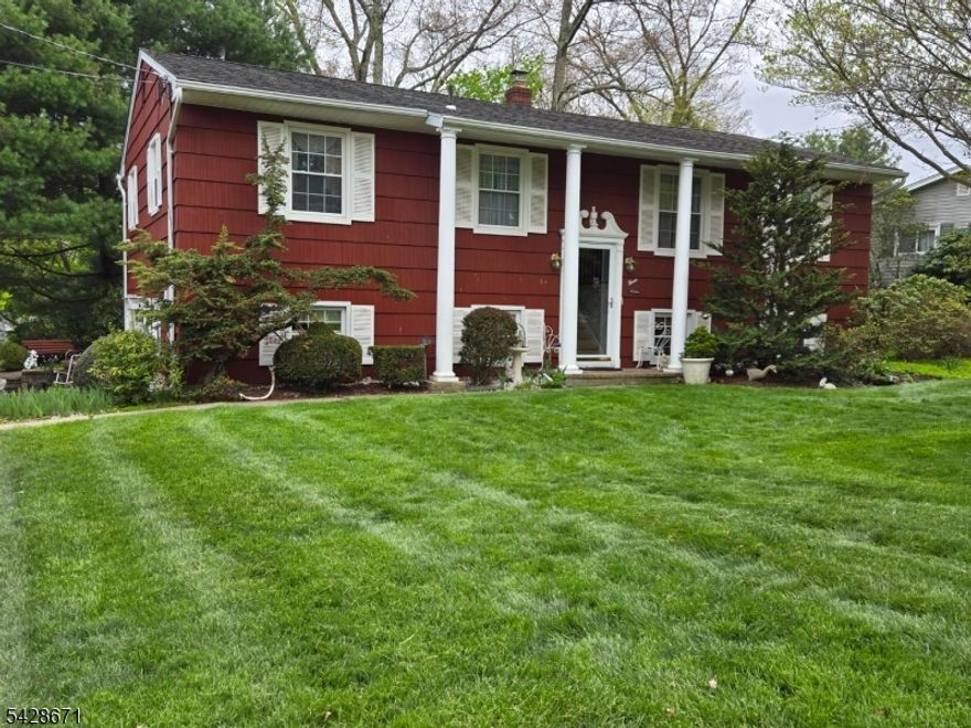 Welcome to this impeccably maintained 1964 bilevel, perfectly situated in the desirable White Rock section of Oak Ridge, just steps away from the lake. The exterior immediately charms with its vibrant red siding and meticulously manicured gardens, which burst into a stunning display of spring blooms. Inside, the home offers a bright and welcoming layout featuring 3 spacious bedrooms and 1.5 bathrooms, all kept in pristine condition. The lower level boasts a full finished basement with a separate entrance and direct garage access, providing incredible versatility and the potential for a 4th bedroom or a private home office. Whether you are relaxing in the sun-drenched living spaces or enjoying the peaceful, garden-filled yard, this home offers a perfect blend of classic character and move-in-ready comfort in a prime lakeside community. Public water, public sewer, natural gas hook up available in the street. Garbage pick up included