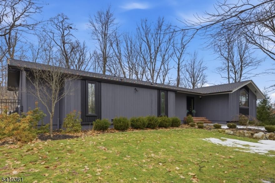 Multiple offers have been received. Please submit any additional offers before Tuesday March 17th at 6pm.Tucked away on a peaceful cul-de-sac, this beautifully updated home sits on a private 1.17-acre lot and showcases extensive improvements by the current owner. Professional landscaping and a welcoming bluestone walkway lead to the front entry, setting the tone for the stylish interior.The reimagined kitchen serves as the heart of the home, highlighted by a stunning feature window that fills the space with natural light. Elegant cabinetry, stainless steel appliances, and an oversized center island create the perfect blend of style and function. The open-concept dining and family room provide an ideal space for everyday living and entertaining.Just off the family room, a spacious sunroom offers additional living space and direct access to the deck, overlooking the tranquil, private backyard.The main level features a primary bedroom with en-suite bath and serene views of the rear yard, along with two additional bedrooms and a full hall bath. The lower level expands the home's versatility with a fourth bedroom, full bath, second family room, exercise room, utility area, and convenient access to the two-car garage.Step outside to enjoy the expansive deck and peaceful natural surroundings perfect for relaxing or entertaining.Fireplace, chimney, and liner are being sold "as is  with no known issues.