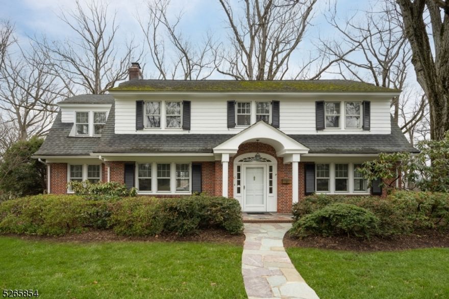 Welcome to 63 Oak Ridge Avenue, a classic brick center hall colonial with timeless elegance. This move in ready, 5 bedroom 2.1 bath home sits on nearly a half acre and offers a refined living experience in the heart of Summit. Upon entering, the first floor entry greets you with a gracious dining room, a well-appointed eat-in kitchen, a serene library, and an expansive front-to-back living room with fireplace, complemented by a sunroom/den that bathes the space in natural light. The second floor boasts 5 ample bedrooms, each offering comfort and space, including a large master suite with an en-suite full bath for luxurious relaxation. The walk out basement level presents a practical layout with a spacious garage, a versatile recreational room for entertainment, ample storage, and a convenient laundry area, opening up to a paver patio. Situated very close and walkable to downtown Summit (to town, train, school and various amenities) you can't beat this location! 63 Oak Ridge Ave provides a serene retreat while being within reach of the vibrant offerings of the town. The property presents a must see opportunity to embrace classic living in an esteemed neighborhood, offering a timeless backdrop for the next chapter of your life. Experience the allure of this classic residence and unlock the potential for your refined living.