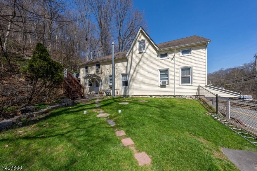 Don't miss this incredible investment opportunity or owner-occupant property set on just over an acre of land, offering space, flexibility, and strong rental potential. This well-maintained three-unit multi-family features a total of 9 off-street parking spaces and a massive side yard perfect for outdoor enjoyment, future expansion, or added amenities.Each unit is separately metered for electric and equipped with its own water boiler and heating furnace, offering added convenience and efficiency for both owners and tenants.The first-floor unit is a beautifully updated 2-bedroom, 1-bath, recently renovated with modern vinyl laminate flooring, providing a fresh and low-maintenance living space.The second and third floors each offer spacious 3-bedroom, 1-bath units with comfortable carpeting throughout. The third-floor unit stands out with a bright skylight in the living room, bringing in abundant natural light and adding a unique, airy feel to the space.Each unit also includes washer and dryer hookups, adding to tenant appeal and everyday convenience.Whether you're looking to live in one unit and rent the others or expand your investment portfolio, this property delivers on space, versatility, and income potential all set on a rare oversized lot.