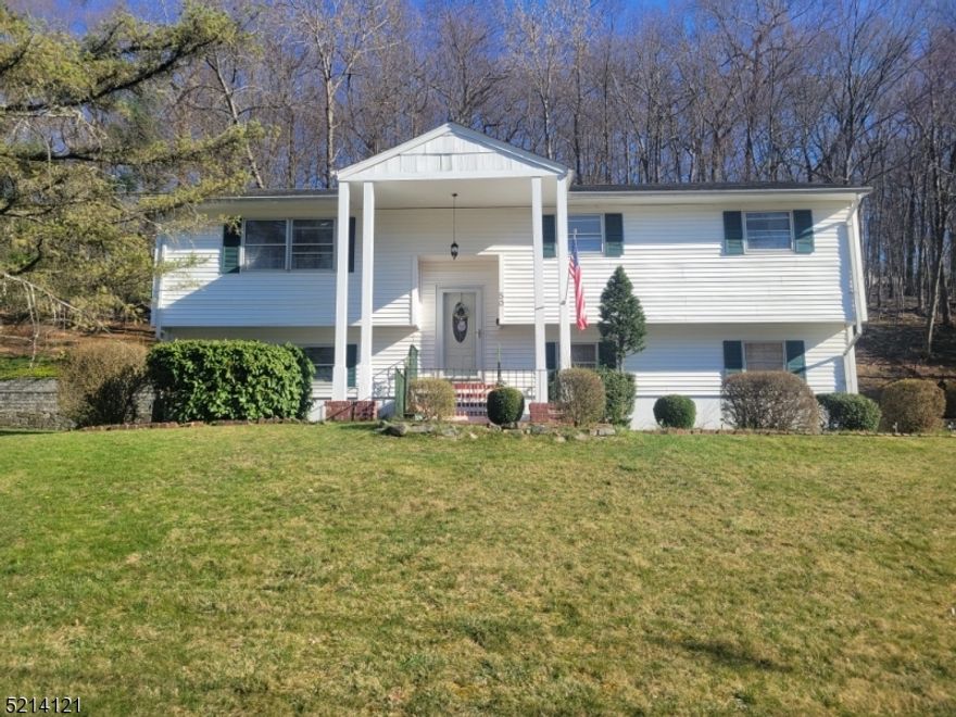 Welcome to 50 Richard Dr. located in the Knolls section of Mt. Arlington. 1st floor with hardwood floors throughout, featuring cathedral ceilings in the living and dining room.  Master bedroom with full bath, 2 additional bedrooms, eat-in kitchen, main bath and pantry in the hallway. Deck access from dining room. Ground level has 4th bedroom, powder room, large family room with fireplace and sliders to the patio, utility room and access to spacious two car garage. Minutes away from the Mt. Arlington train/bus station, route 80, 46, 10 and 206.