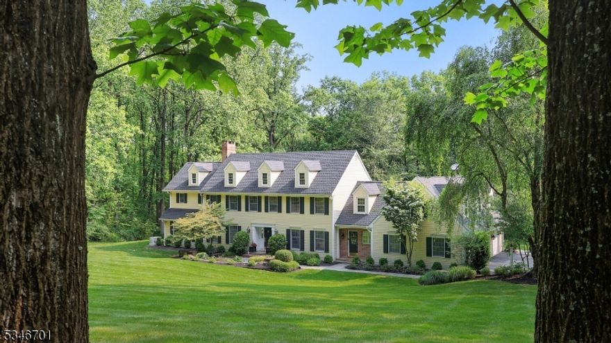 Welcome to the perfect blend of convenience, privacy, and neighborhood charm. This sprawling and spacious 4-bedroom, 4-bath Colonial makes a statement from the moment you arrive, with a brick-pillared entrance and winding driveway leading to a traditional yet inviting home. Inside, the foyer opens to a formal living room with a gas fireplace and an adjacent sunken library with built-in shelving and French doors to the rear patio. The family room offers a cozy wood-burning fireplace framed by floor-to-ceiling windows and patio access, creating an ideal flow for entertaining.The chef's kitchen features custom wood cabinetry, stone countertops, a terra cotta backsplash, professional-series appliances, a spacious center island with breakfast bar, pantry, large eat-in area, and a convenient rear staircase. Upstairs, the primary suite is a true retreat with dual fitted walk-in closets, a dressing area, and a spa-like bath with soaking tub and oversized stall shower. Three additional bedrooms, two baths, an office, bonus room, and exercise room complete the level.The unfinished basement offers ample storage or the opportunity to customize. Outdoors, a stone patio with built-in fireplace, fire pit, and BBQ overlooks a sweeping lawn perfect for gatherings. Upgrades since 2020 include roof, generator, , 3 central air cond, 3 furnaces, 2 whole house humidifiers, 2 attic fans, and hot water heater. Convenient to town, schools, and NJ Transit, this property offers it all.
