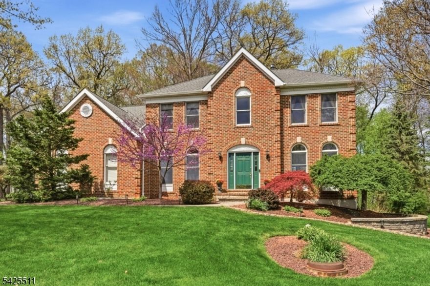 Lovingly cared for by original owners, this stately Colonial is located in the highly sought-after and established neighborhood of Brass Castle Estates. This gracious home features rich oak hardwood floors, a neutral designer palette, and a beautifully renovated gourmet kitchen showcasing 42" cabinetry, granite countertops, stainless steel appliances, and wine refrigerator. The expanded family room flows seamlessly from the kitchen and serves as the perfect gathering space, highlighted by oversized windows, a soaring cathedral ceiling and a striking brick gas fireplace. The second level offers four generously sized bedrooms, a full hall bath, and abundant closet space. The primary suite is a true retreat, featuring a stylishly updated ensuite bath and a spacious walk-in closet. Enjoy peaceful, scenic views from every window throughout the home and a 2 year old roof. The partially finished basement offers ample recreation and storage areas. Outdoors, relax on the expansive bluestone patio, overlooking a flat, private backyard with beautifully maintained professional landscaping. Picturesque Union Township is known for easy access to route 78, Clinton and Flemington, as well as serene countryside views and rural surroundings. An excellent school district includes the Blue Ribbon North Hunterdon HS. Hundreds of acres of parkland, an active township Recreation Committee and a central location about 55 miles west of New York City make Union Township a top residential destination.