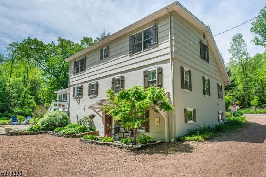 Discover a rare opportunity to own a private, wooded retreat that blends the beauty of nature and comforts of modern living. This charming 4 bedroom, 3 bath residence offers timeless appeal. From the moment you enter the property, its pond and a gently winding stream add a sense of calmness, with large outdoor space for activities. The heart of the home is the renovated kitchen complimented with an abundance of counter space, updated appliances, and an intuitive layout making cooking and entertaining a pleasure. Unwind in the sunroom, a bright and cheerful space that allows you to enjoy all four seasons from the comfort of indoors. Overall space is a major advantage with generously sized bedrooms, ample closet space and additional storage. The home's primary suite has been thoughtfully enhanced with a completely updated ensuite bath, featuring spa inspired touches including custom tile, updated fixtures, and a relaxing ambiance. Three additional bedrooms provide ample space for guests or a home office setup. Downstairs, the fully finished walkout basement offers bonus space with access to the backyard equipped with a gazebo and a sports court. Best of all, this one-of-a-kind home is located in the highly sought after West Morris Central (WMC) School District, known for its academic excellence. Come experience the magic of this home and imagine the lifestyle it could offer.