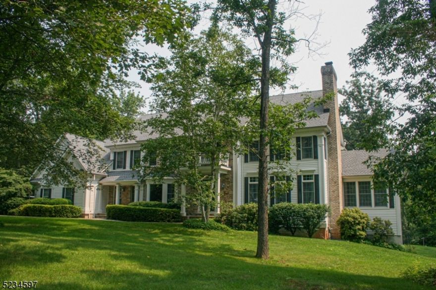 Nestled on a quiet street in sought after Basking Ridge, (with a Far Hills mailing address) this lovely 5 bedroom, 4.2 bath Colonial home is on 2.6 acres on a cul-de-sac. You will feel at ease, driving through the quaint and quiet neighborhood. Pride of ownership is evident when you enter into this thoughtfully designed home with spacious bedrooms, hardwood floors, three fireplaces, 10' ceilings on the first floor and 9' ceilings on the second floor. Unwind in one of the many cozy rooms. A bright and airy family room with a fireplace is open to the kitchen and deck and perfect for entertaining. The large formal living room has a fireplace, wood floors and detail molding throughout. The primary bedroom has two walk-in closets, wood floors and a tray ceiling. There is a finished walk-out basement with a den, full bathroom and bonus room. The back stair access to the second floor emerges into a spacious, sunny room adjacent to a private bedroom and full bath. ideal for a in-law suite. A three car garage and a private wooded backyard complete this exceptional home. New roof and HVAC system in 2020. Basking Ridge's location and amenities have long made it a community of choice. New Jersey transit and major highways are conveniently accessible. The home is close to town with its many shops and restaurants. Basking Ridge is also known for it's excellent school system.