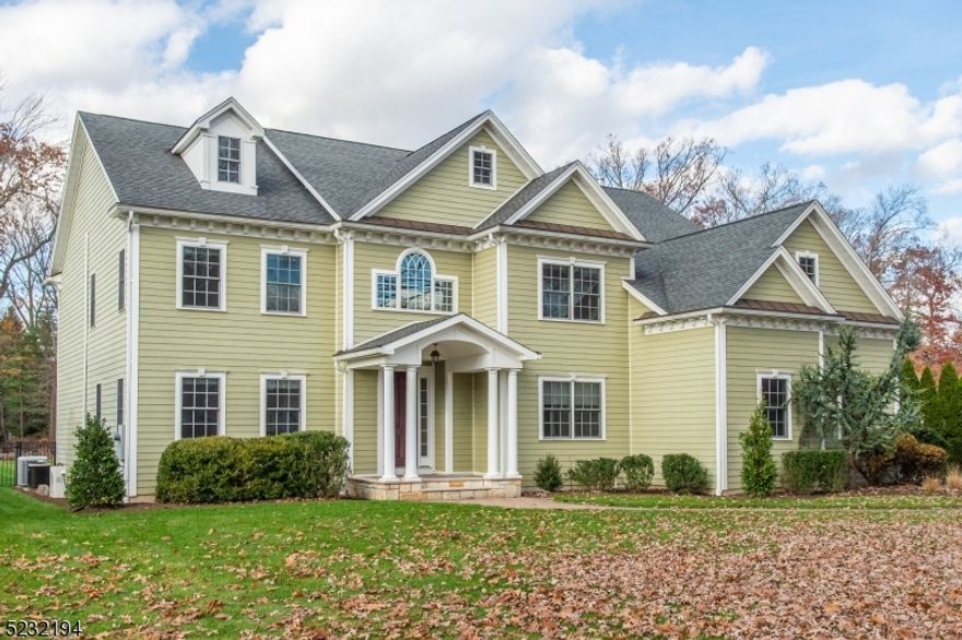 Welcome to this exquisite custom-built Colonial residence, boasting five spacious bedrooms and six luxurious full baths. Set on a sprawling level .57-acre lot, this home offers an impressive living space spanning approximately 5300 sq. ft., including a finished third level. As you step inside, you'll be greeted by a grand two-story entryway, setting the tone for the elegance that awaits. The flexible open floor plan allows for seamless flow throughout the home, perfect for both entertaining and everyday living. An abundance of natural light fills the gourmet center island kitchen, creating a warm and inviting atmosphere. The front-to-back living and dining area provides ample space for gatherings and showcases the home's meticulous attention to detail. Retreat to the primary bedroom suite, complete with a cozy sitting room, walk-in closets, and luxurious bath, offering a serene oasis for relaxation. The four additional generously sized bedrooms feature well-appointed baths, ensuring comfort and convenience. Additional highlights of this remarkable property include a convenient first-floor office/bedroom, a second-floor room, 9 ft ceilings on the first and second floor, built-ins, Brazilian Cherry floors & custom trim. Step outside and savor the tranquility of the professionally manicured yard, offering peaceful private views. Unwind or entertain on the inviting paver patio. Minutes away from schools, shops, restaurants, and transportation.