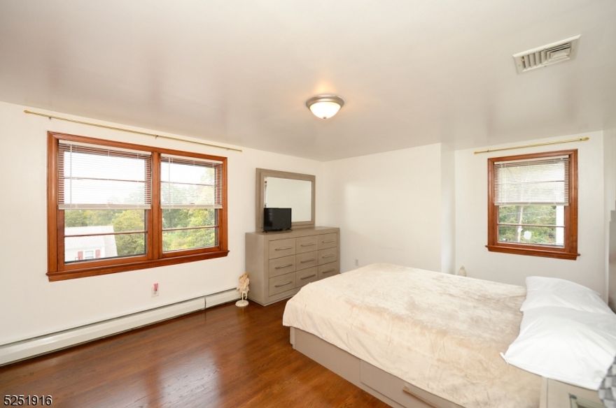 This 2 Family Home is in a wonderful, quite location in Hawthorne. Minutes to Goffle Park, a few blocks to the Bus and NJ Transit, then on to the Heart of downtown, movie Theater, restaurants, shopping,houses of worship. The second floor apartment has 2 spacious Bedrooms, Living room, Kitchen, Bath. Hardwood Floors through out, Storage in the Attic, Central Air. Sunny and Bright Large size rooms, great view of New York City.