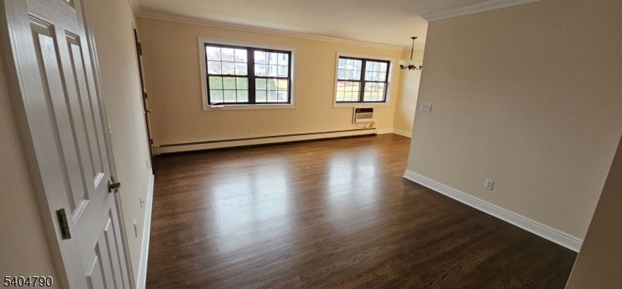 Fabulous 1st floor totally remolded apartment. Sun Drenched Dining Rm living rm featuring beautifully redone gleaming hardwood floors.Primary Bedroom offers hardwood floors & good closet space. Brand New Kitchen with all new appliances. Basement features coin operated washer & Dryer