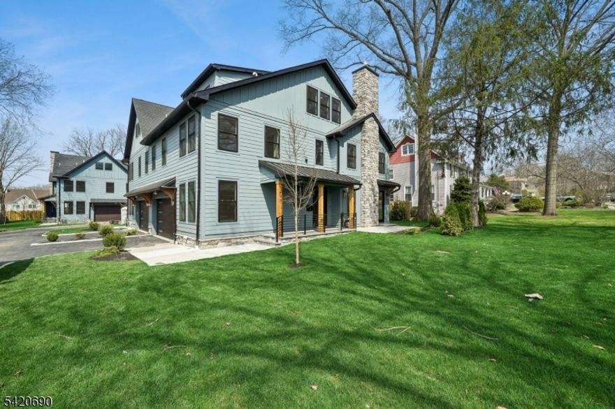 Welcome to Central Villas, a refined end-unit townhome in the heart of New Providence, & a seamless blend of modern design & effortless living. Built by Summit General Construction, this 4-level residence spans approx. 4,450 sq ft, offering 4 bedrooms, 5 full baths, & a versatile 1st-floor office or optional 5th bedroom.Designed for modern living and effortless entertaining, the home features hardwood flooring throughout. The main level showcases a striking living area anchored by a sleek gas fireplace, while the formal dining area opens to a private backyard patio, creating seamless indoor-outdoor flow.The chef's kitchen offers custom cabinetry, a waterfall island, premium Thermador appliances, & a pantry just off the garage entry,a coat closet.The 2nd floor features 3 bedrooms each with a Walk In Closet., & the primary suite offers a tray ceiling & spa-like bath with soaking tub, frameless glass shower, & designer vanities. A full hall bath & laundry complete the level.The top floor offers a sunlit, private suite with soaring ceilings, an en-suite bath, & generous storage, perfect for guests, work, or quiet retreat.The finished lower level adds even more living space, with porcelain tile flooring, decorative wall paneling, a modern electric fireplace, & a full bath ideal for a media lounge, recreation area, or home gym. Additional highlights include a 2-car garage with 12-ft ceilings, EV charger, energy-efficient systems, smart keyless entry, & a 10-year builder warranty.