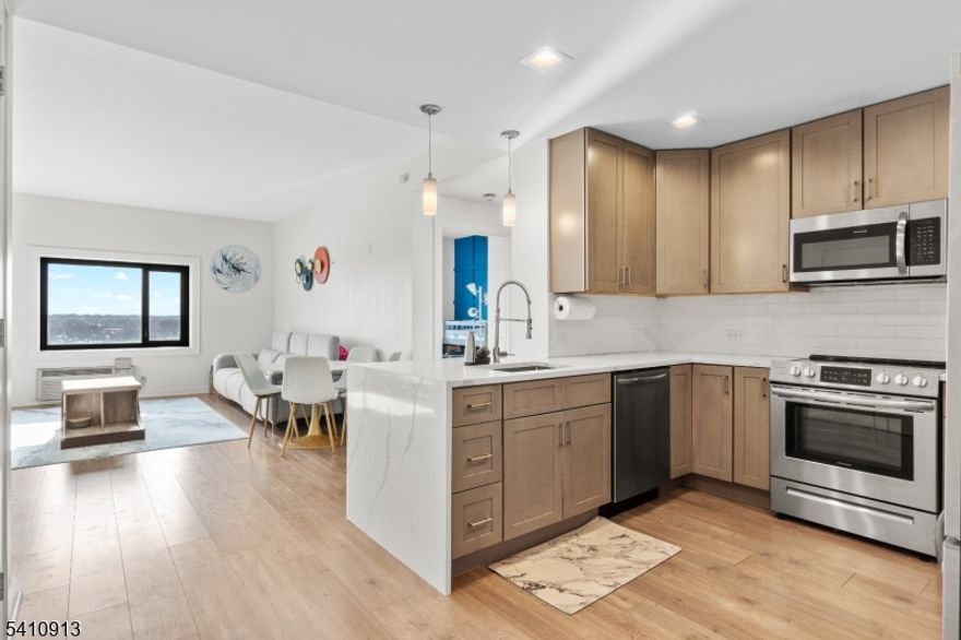 Welcome to this beautiful 2 bedroom, 2 bath unit in the heart of Rahway! Features a spacious modern layout with in unit washer and dryer for ultimate convenience. Located directly across from the Rahway Train Station for an easy NYC commute and just minutes to major highways, the Garden State Parkway, NJ Turnpike, and the Verrazano Bridge to Staten Island. Building amenities include a gym and rooftop deck. Close to shopping, dining, and the police station. Prime location, this won't last!