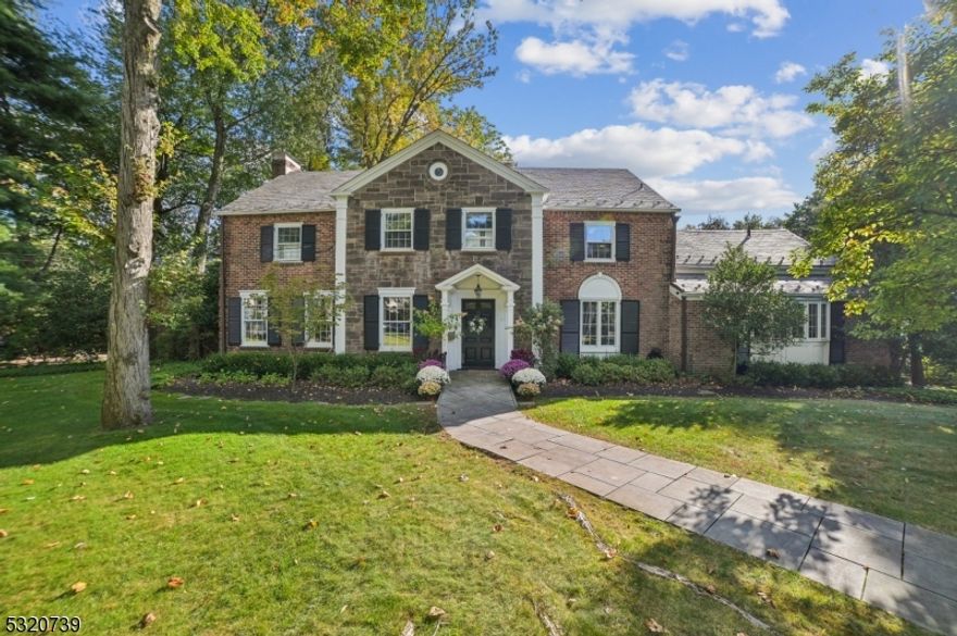 Majestic All Brick Center Hall Colonial ideally located in most coveted location on prestigious North Pond in most desirable location in Short Hills! South facing, so it gets great natural light! You will love the spectacular water views from almost every room, including the 1st floor living room, dining room, sunroom, and family room. Your guests will be impressed once they enter the grand hallway with an elegant staircase. The bright eat-in kitchen has top of the line appliances as well as built-in seating for cozy dinners, and opens to the huge, beautiful family room, with large floor to ceiling sliding doors out to the bluestone patio & stunning backyard with water views. The living room features gorgeous molding, great natural light and a fireplace. The sunroom has exposed brick, incredible views from 3 exposures, and access to the breathtaking backyard. There is a handsome library with fireplace, a perfect spot to relax. The formal dining is spacious, perfect for entertaining. The 2nd level boasts a luxurious Primary Suite with updated spa-like primary bath, a bright office and custom walk-in closet. 4 more bedrooms & a beautiful full bath complete the 2nd level. Large walkout basement includes recreation room / potential bedroom & full bath, ideal nanny suite, as well as a billiard/playroom. Spectacular private backyard oasis with breathtaking water views and bluestone patio complete this stately residence. Do not miss this RARE opportunity to own the regal residence!