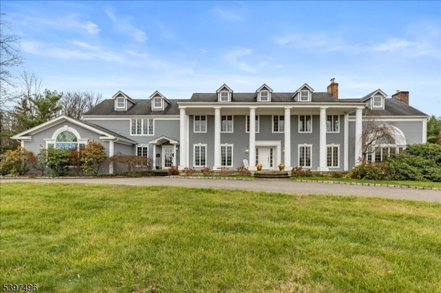 Set on 3.8 private acres this Bernards Township estate offers a classic and spacious home with generously sized rooms and a floor plan that supports both everyday living and large gatherings. Designed with comfort and practicality in mind, the home features four bedrooms, including two primary bedroom suites and four full and two half baths and a bonus room. Multiple fireplaces, traditional finishes, custom built-ins, and well-proportioned living areas give the home a warm and timeless feel. The layout includes a dedicated library with barn-style doors and both formal and casual living spaces.In the finished lower level, you will find a wine room with beautiful iron scroll doors as well as additional rooms to fit your needs. Outdoors, the property includes a pool with waterfall feature, pergola, gazebo, and built-in barbecue ideal for seasonal enjoyment and entertaining.A circular driveway and four-car garage offer ample parking and storage. Located within the Bernards Township school district and offering a Far Hills mailing address, this home located near shopping, dining and transportation is sure to please!