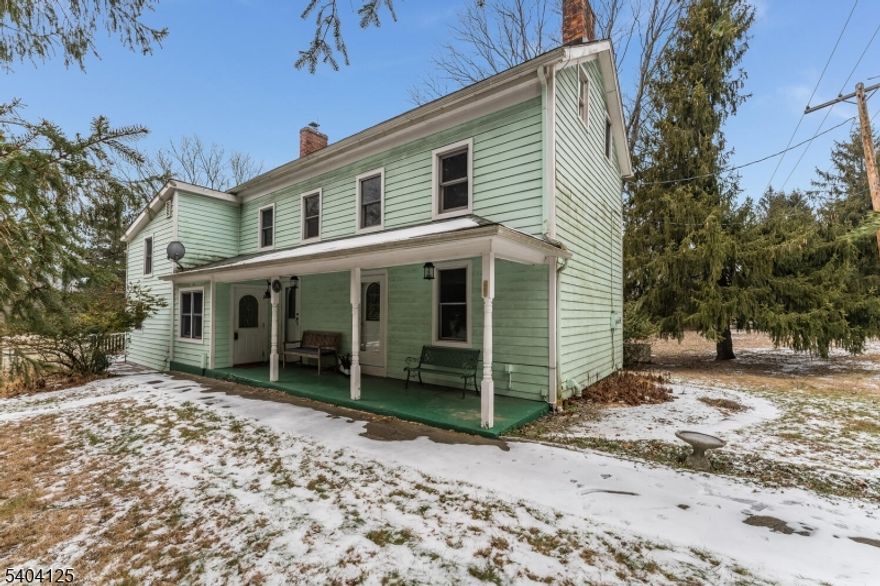 Exquisite country charm abounds in this 1889 Farmhouse style colonial!  Upon entering this home your greeted by a sizable stone fireplace in the kitchen that is consistent with the era. To the left of the fireplace is a sunken dining rm. Spacious enough for entering of all sizes! The dining rm is augmented by the fireplace stone work. A hidden laundry room is adjacent for convenience. To the right of the magnificent fireplace is a beautiful living rm perfect for entertaining or relaxation  The living rooms built in cabinet will be a topic of instant conversation.  Wooden ceiling beams & Hardwood wide planked floors abound through out the first & second floors. A large winding staircase leads to a 2nd floor landing . To the left of the landing are 2 bedrooms and full bath. Continue on the staircase and you'll arrive on a hallway which will lead to the master bedroom, a second full bath and additional bedroom. This charming house isn't finished yet..an additional winding staircase in 4th bedroom, which is currently being used as an office/bedroom, leads to a cozy loft. An additional staircase is used to access the walk up attic. The picturesque property includes multiple outbuildings along with a large Barn that have water & electric  to them. A whole house generator completes this home!